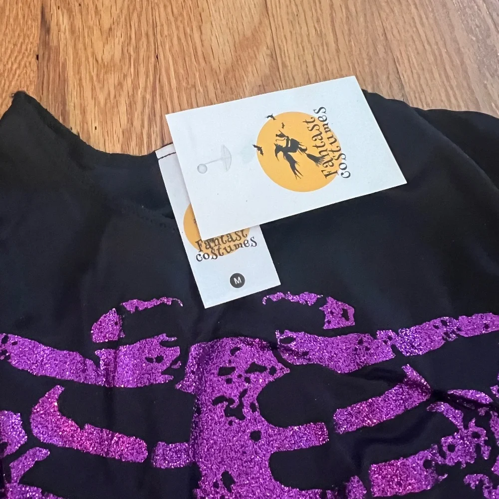- purple glitter and black witch costume